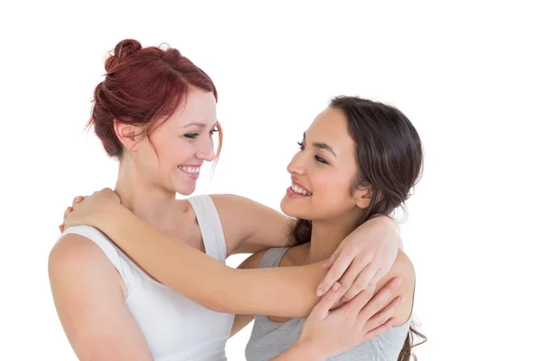 Close-up of a young female embracing her friend — Stock Photo, Image