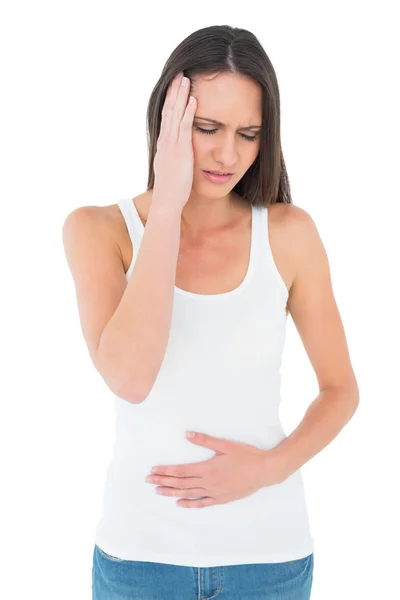 Displeased woman with stomach pain and headache — Stock Photo, Image