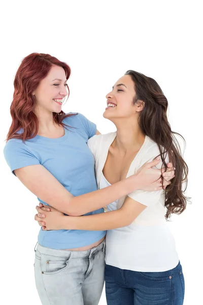 Happy young female embracing her friend — Stock Photo, Image