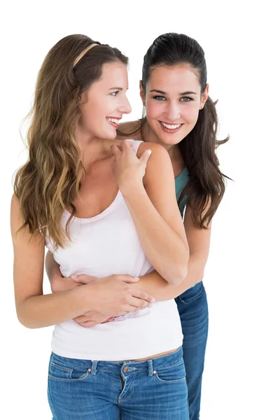 Happy female embracing her friend from behind — Stock Photo, Image