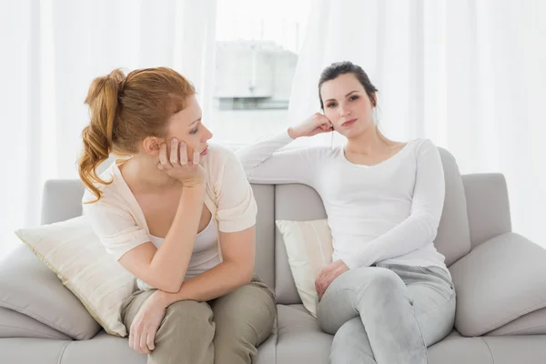 Unhappy friends not talking after argument on the couch — Stock Photo, Image