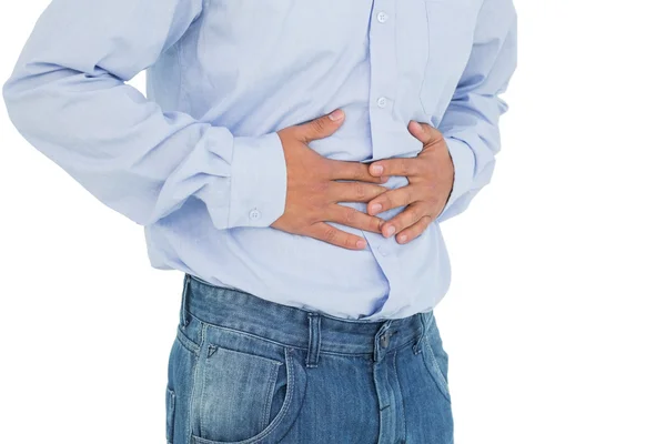 Close-up mid section of a casual man with stomach pain — Stock Photo, Image