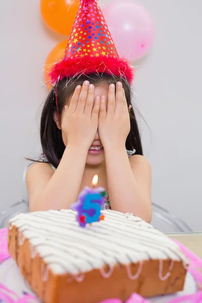 Girl covering her face at the birthday party — Stock Photo, Image