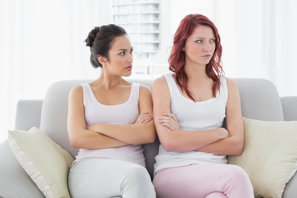 Unhappy friends not talking after argument at home — Stock Photo, Image