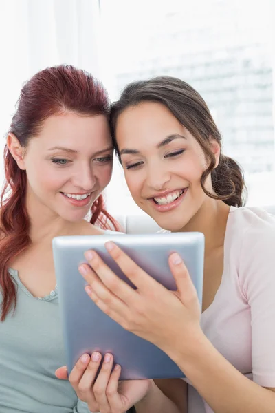 Close-up of young female friends using digital tablet — Stock Photo, Image