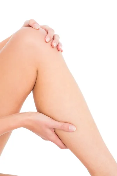 Close-up mid section of a woman with leg pain — Stock Photo, Image