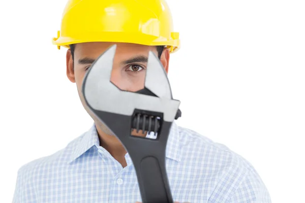 Close-up portrait of a young handyman with a wrench — Stock Photo, Image