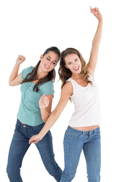 Two cheerful young female friends dancing — Stock Photo, Image