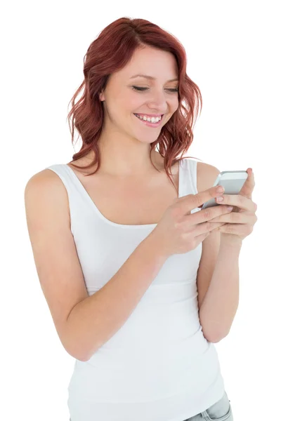 Smiling casual young woman text messaging — Stock Photo, Image