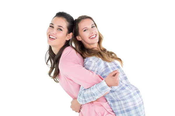 Young woman carrying female friend on back — Stock Photo, Image