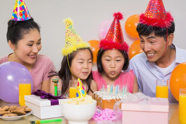 Family with cake and gifts at a birthday party — Stock Photo, Image
