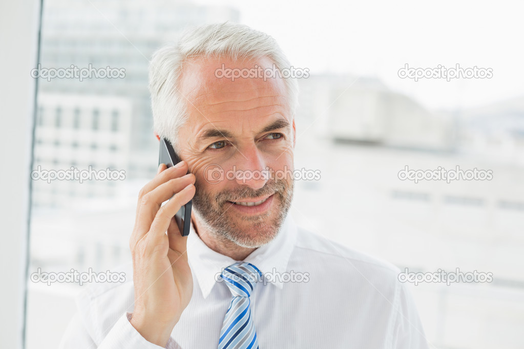 Close-up of a mature businessman using mobile phone