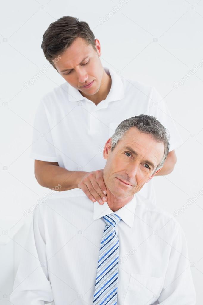 Chiropractor doing neck adjustment