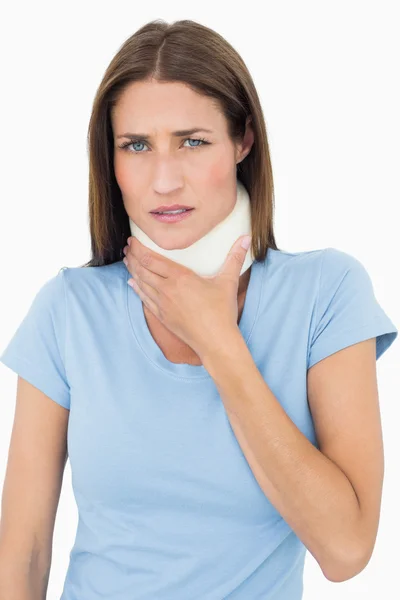 Portrait of a young woman wearing cervical collar — Stock Photo, Image