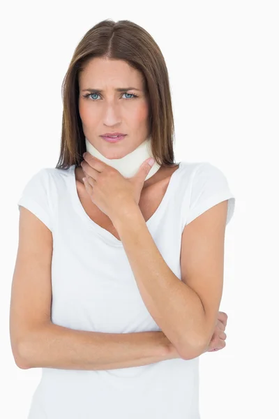 Portrait of a young woman wearing cervical collar — Stock Photo, Image