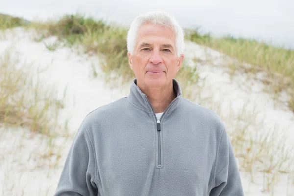 Portrait of a handsome senior man at beach — Stock Photo, Image