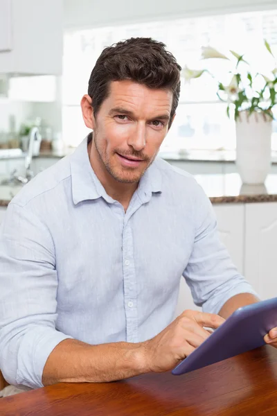 Young man using digital tablet at home — Stock Photo, Image