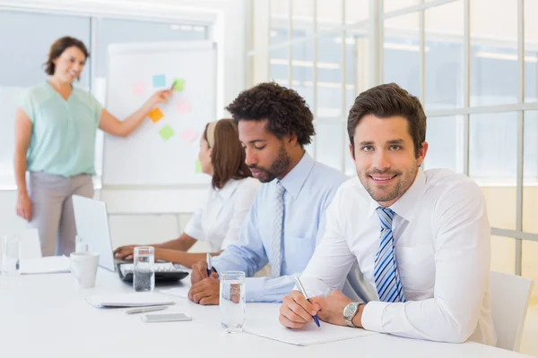 Businessman with colleagues in boardroom meeting — Stock Photo, Image