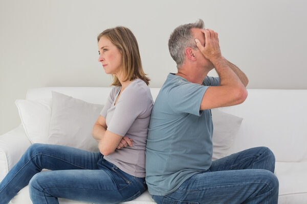 Unhappy couple not talking after an argument at home