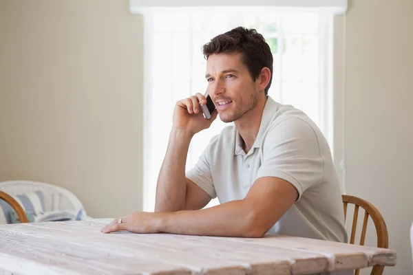 Side view of a young man using mobile phone — Stock Photo, Image