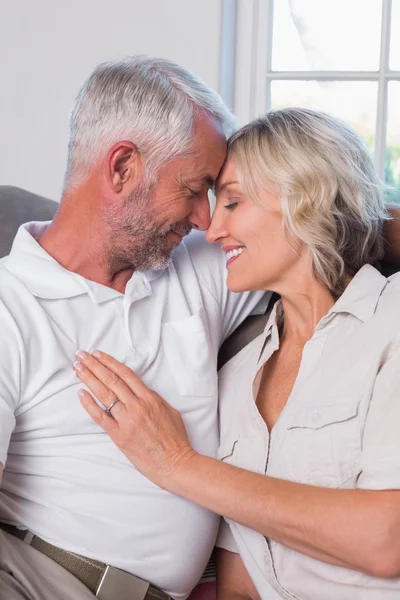 Relaxed mature couple with head to head and eyes closed — Stock Photo, Image