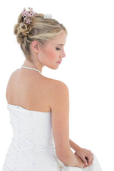 Bride in off shoulder dress against white background Stock Image