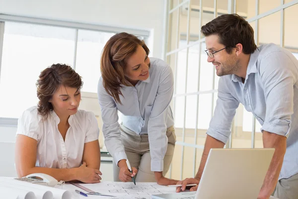 Business people working on blueprints at office — Stock Photo, Image