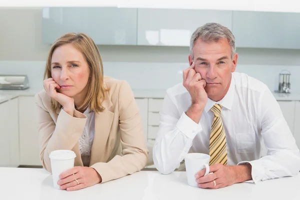 Business couple not talking after an argument in kitchen — Stock Photo, Image