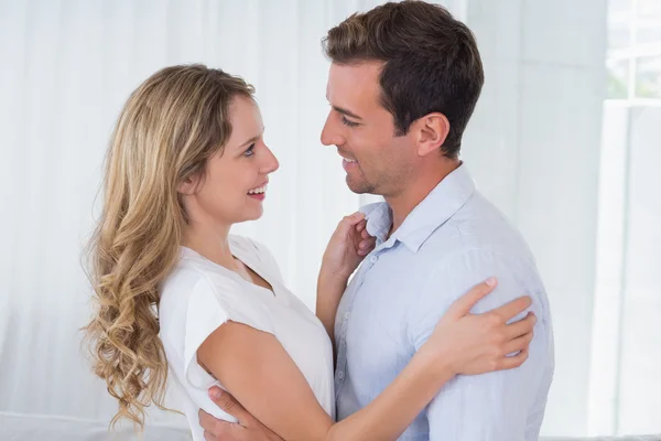 Loving couple looking at each other at home — Stock Photo, Image