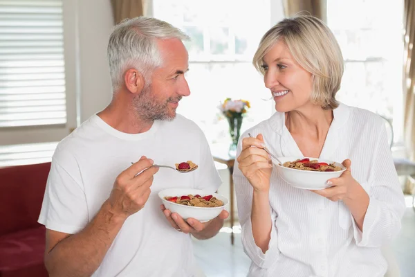 Loving mature couple having breakfast at home — Stock Photo, Image