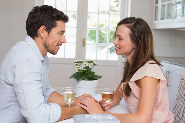 Loving couple with wine glasses looking at each other — Stock Photo, Image