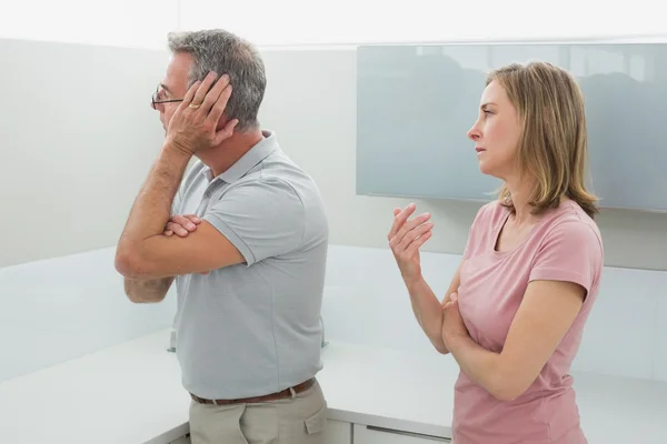 Unhappy couple having an argument in kitchen — Stok fotoğraf