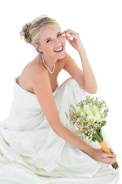 Happy bride holding flower bouquet — Stock Photo, Image