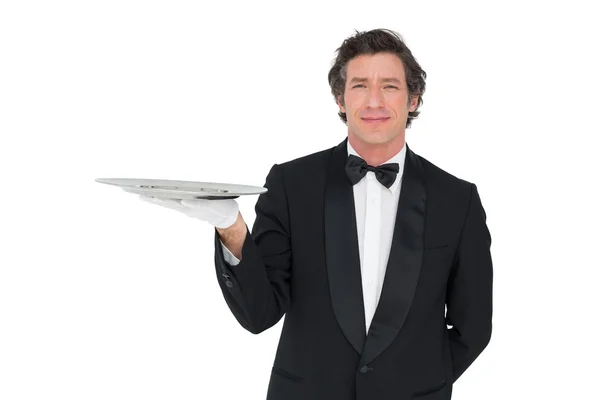 Confident waiter holding serving tray — Stock Photo, Image