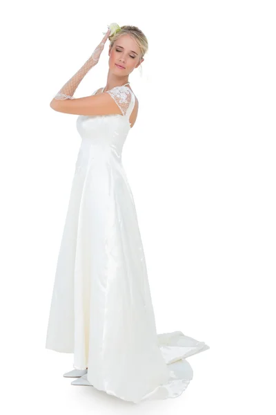 Bride with eyes closed posing against white background — Stock Photo, Image