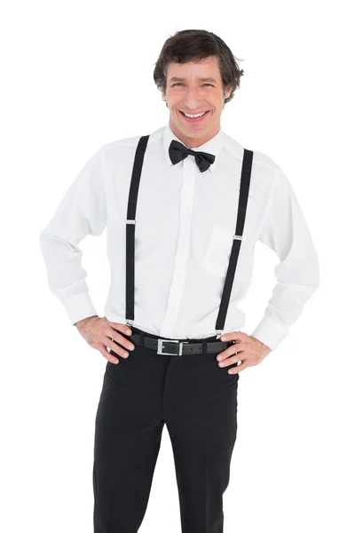 Smiling groom wearing suspenders — Stock Photo, Image