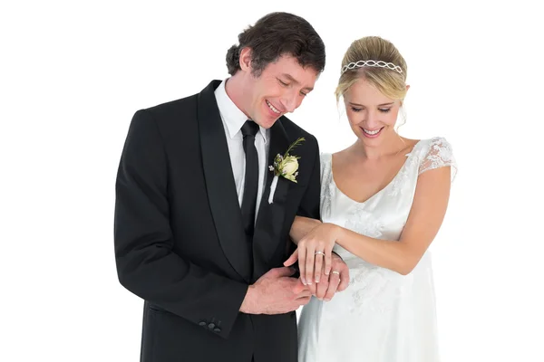 Newlywed couple looking at wedding rings — Stock Photo, Image