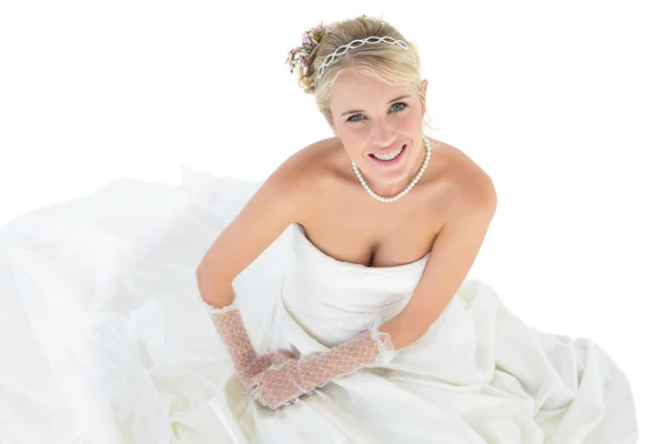 Portrait of bride sitting over white background — Stock Photo, Image