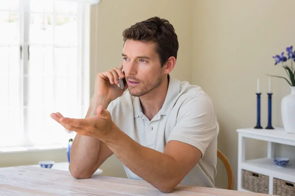 Man using mobile phone at home — Stock Photo, Image