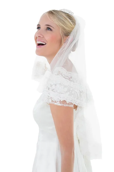 Surprised woman in wedding dress over white background — Stock Photo, Image