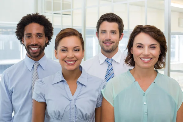 Smiling young business people in office — Stock Photo, Image