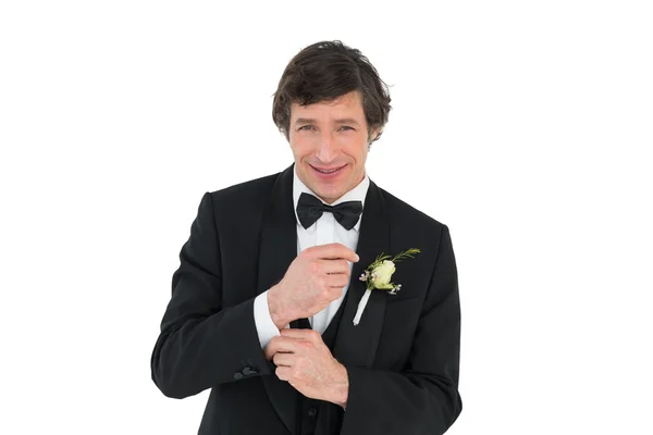 Smiling groom in tuxedo getting ready — Stock Photo, Image