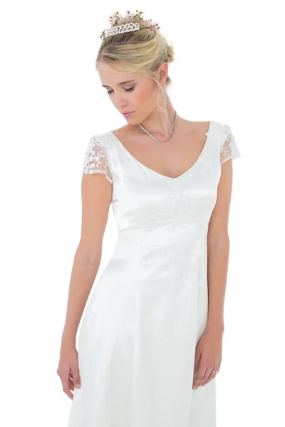 Shy bride with eyes closed against white background — Stock Photo, Image