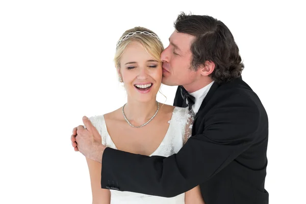 Groom kissing beautiful bride — Stock Photo, Image