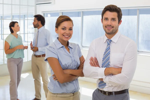 Portrait of a business couple with colleagues at office — Stock Photo, Image