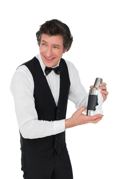 Bartender using cocktail shaker over white background — Stock Photo, Image