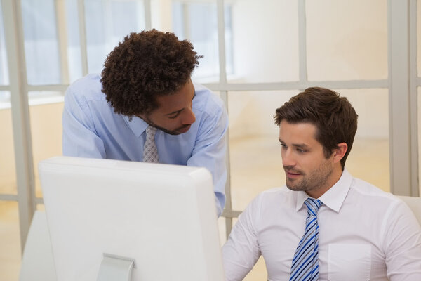 Businessmen working on computer in office Stock Image