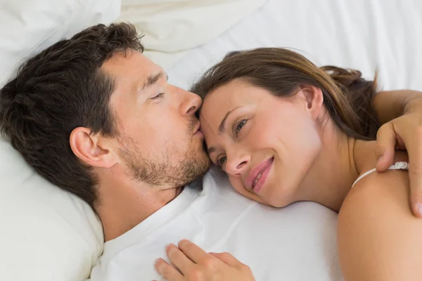 Relaxed couple sleeping together in bed Stock Image