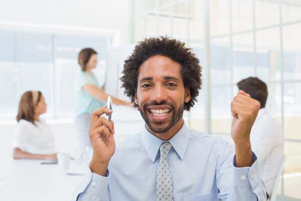 Businessman with colleagues in meeting at office Stock Picture