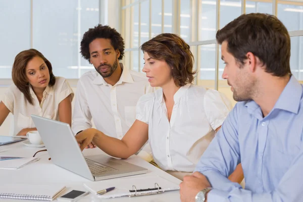 Business people using laptop in meeting at office Royalty Free Stock Photos